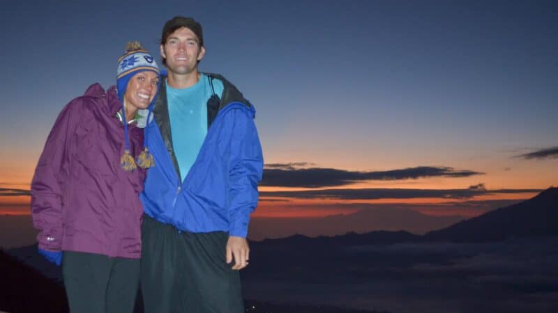 Manand woman trekking Mount Batur at sunrise in Bali