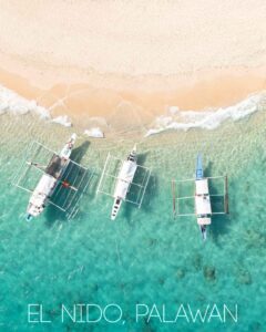 Three Filipino Boats anchored on a beach in the Palawan
