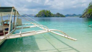 Boat parked on the beach in Coron Palawan - How to get to Coron Palawan