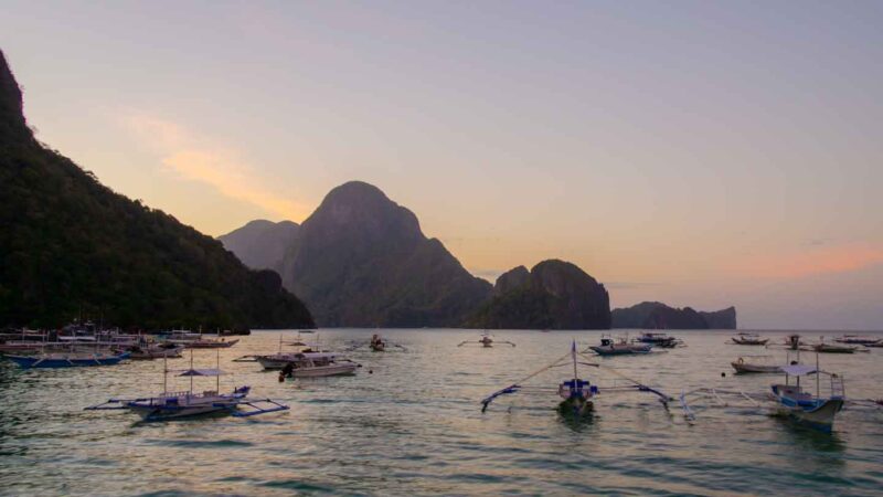 View of the sunset over the islands surrounding El Nido from the El Nido town in Palawan Philippines