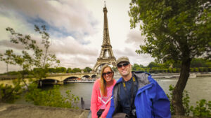Couple in front of the Eiffel tower in Paris