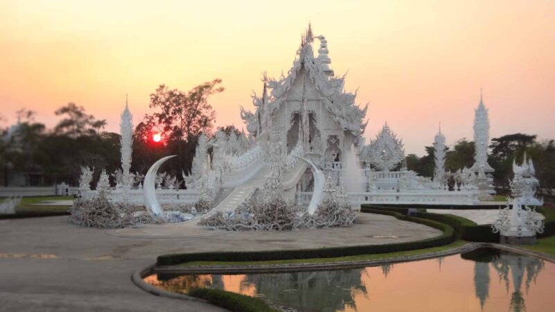white temple of Chiang Rai at sun set - day trips near Chiang Mai - Northern thailand