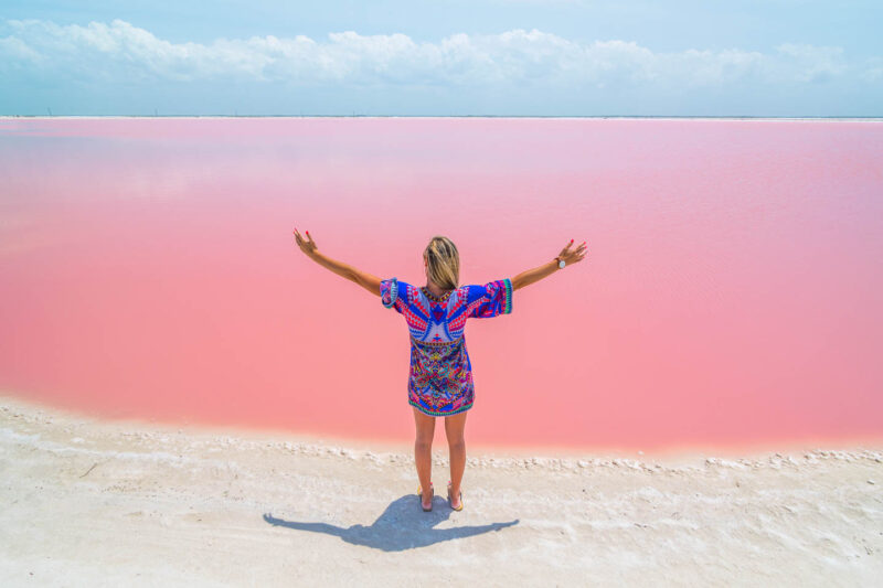 Las Coloradas Yucatan Pink Lake in Mexico, girl standing at the lake
