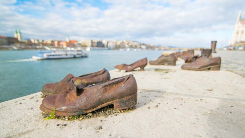 Bronze shoes sit on the ledge of the Danube as a reminder of the men and women killed here