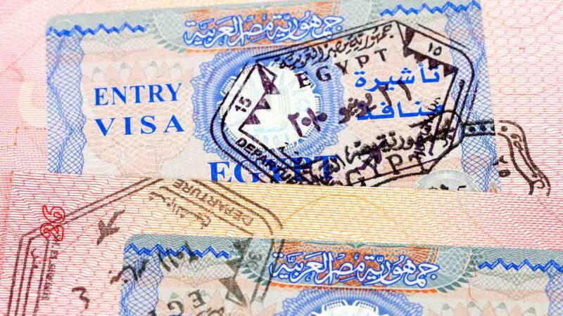 passport with Egypt visa sticker and passport stamp