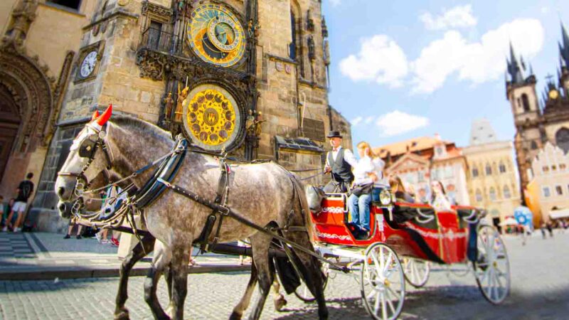 Red Horse Carriage in front of the Astronomical Clock Tower in Prague's Old town square - Top Things to do in Prague