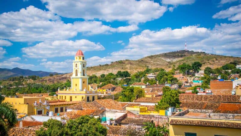 Trinidad Cuba Travel Guide - Things to do in Trinidad - PALACIO CANTERO Best Lookout in Trinidad with yellow bell tower and mountains behind