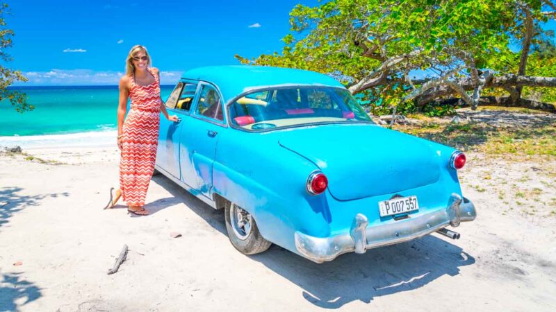 Blue Ford car in front of the beach of Playa Jibacoa