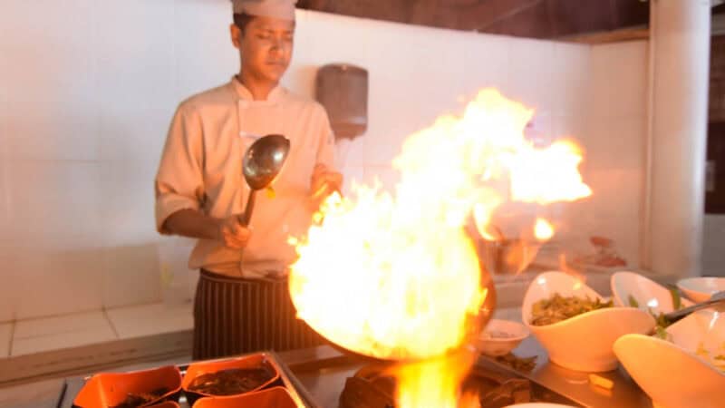 Chef preparing food at Cinnamon Dhonveli Maldives