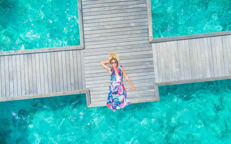 How to Maldives photo guide - Woman laying on the dock-1