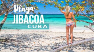 Playa Jibacoa Cuba Feature woman on the beach with text writing over image