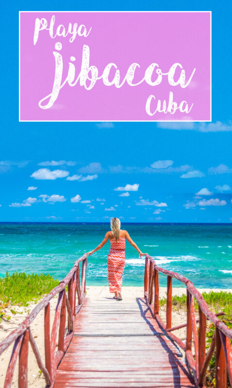 Playa Jibacoa Cuba woman at the end of along bridge at the beach