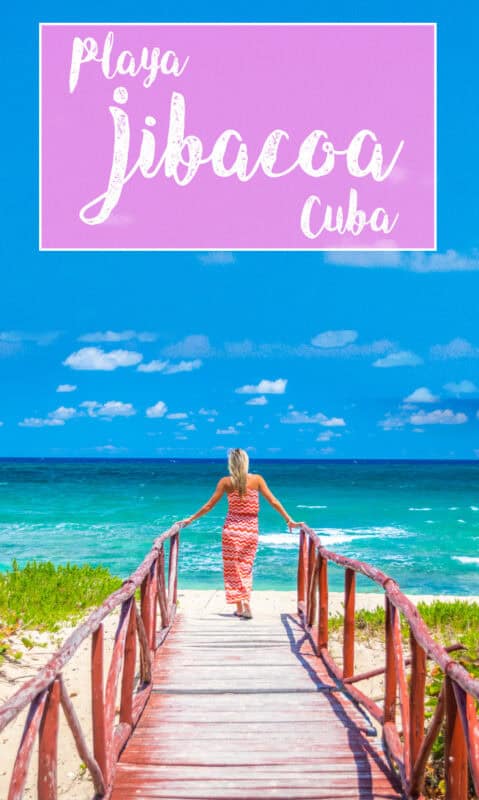 Playa Jibacoa Cuba woman at the end of along bridge at the beach