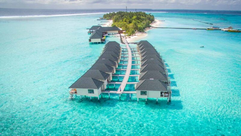 Over the water bungalows in the Maldives at Summer Island Maldives resort shot from DJI phantom dron