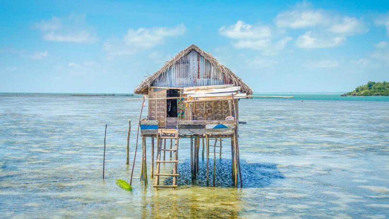 Bajo village typical wooden house over the water in Wakatobi Indonesia