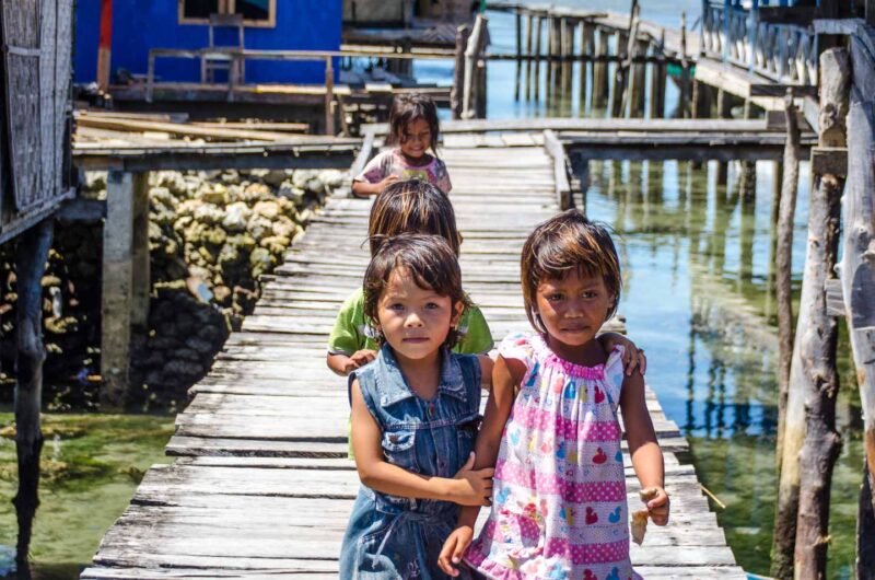 Baja young girls on the dock in Wakatobi Indonesia