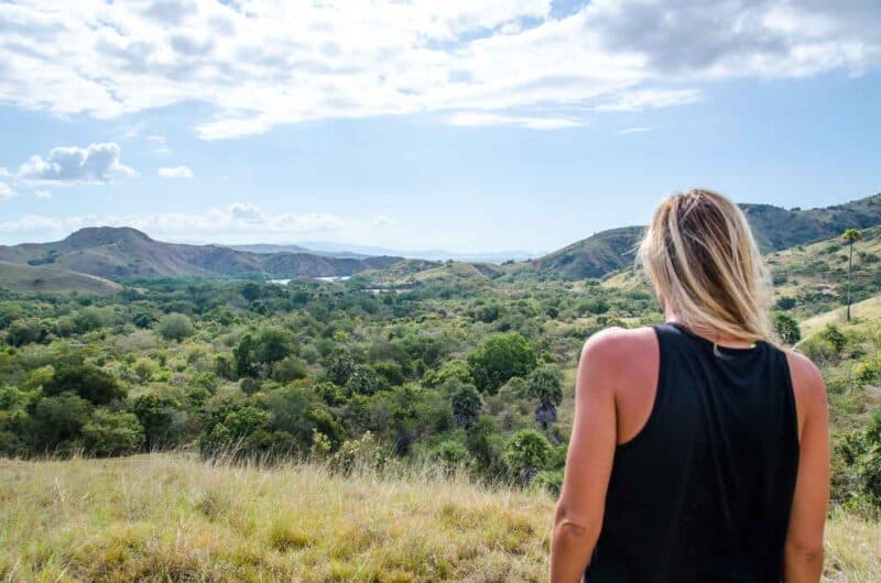 Girl on Rinca Island in Komodo National Park looking for Komodo Dragons