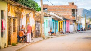 Trinidad Cuba street and locals sitting outside