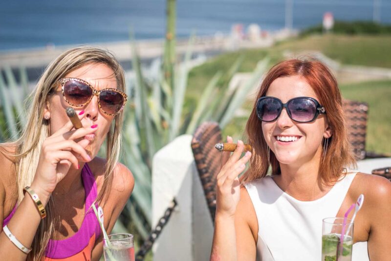 2 girls smoking Cuban cigars in Havana Cuba - Things to do in Havana Cuba