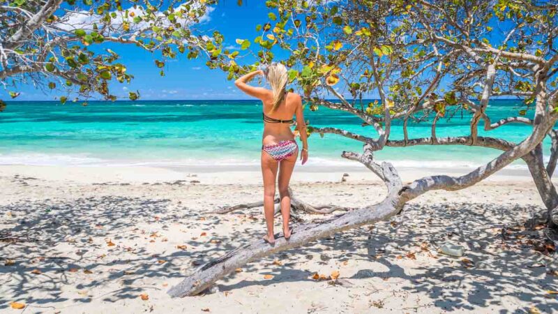girl standing on a tree branch on Playa Jibacoa Cuba
