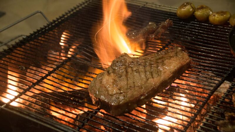 Steak on the grill at Portuguese - things to do in Macau 