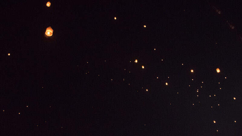 floating lanterns in the sky at Yi Peng Lantern festival Chiang Mai Thailand