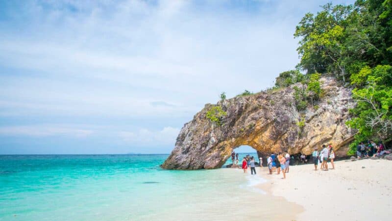 Crowds gathering at the stone arch in Koh Khai Thailand near Koh Lipe