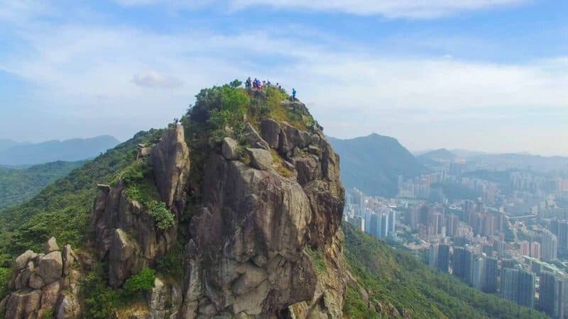 People standing at the top of the hike at Lions Rock