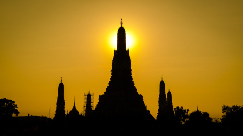 Sunset over Wat Arun in Bangkok a Thailand honeymoon destinations