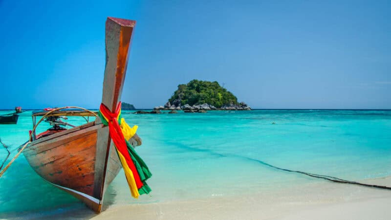 Longtail boat on sunrise beach in Koh Lipe Thailand from our honeymoon