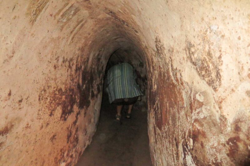 Walking through the Narrow Cu chi tunnels in Vietnam
