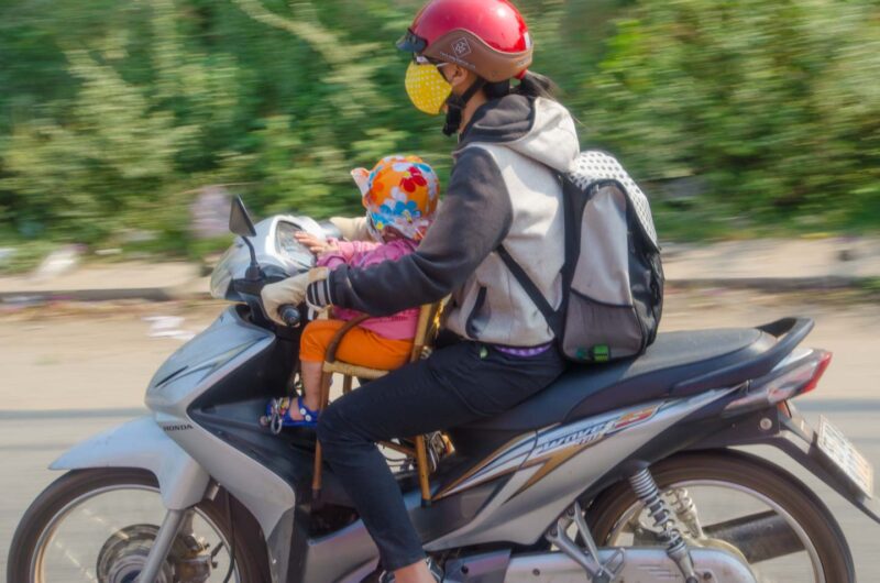 Vietnamese women and child on a motorbike in Da Nang Vietnam