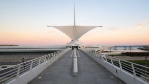 White winged Milwaukee Art Museum MAM - Calatrava - bridge with sunset behind museum - Places to visit in Milwaukee