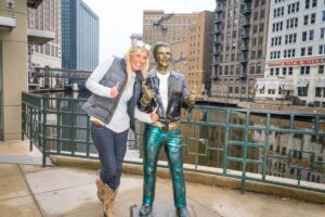 Girl with the Fonze statue in Downtown Milwaukee