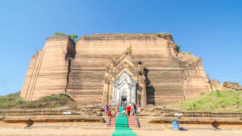 Photo of the red brick Mingun Pahtodawgyi temple in Mingun near Mandalay - Things to do in Mandalay