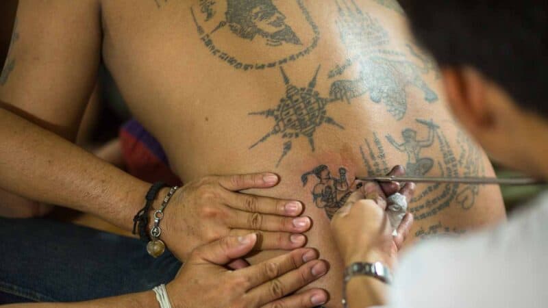 Monk giving a Thai Magic Sak Yant Tattoo 