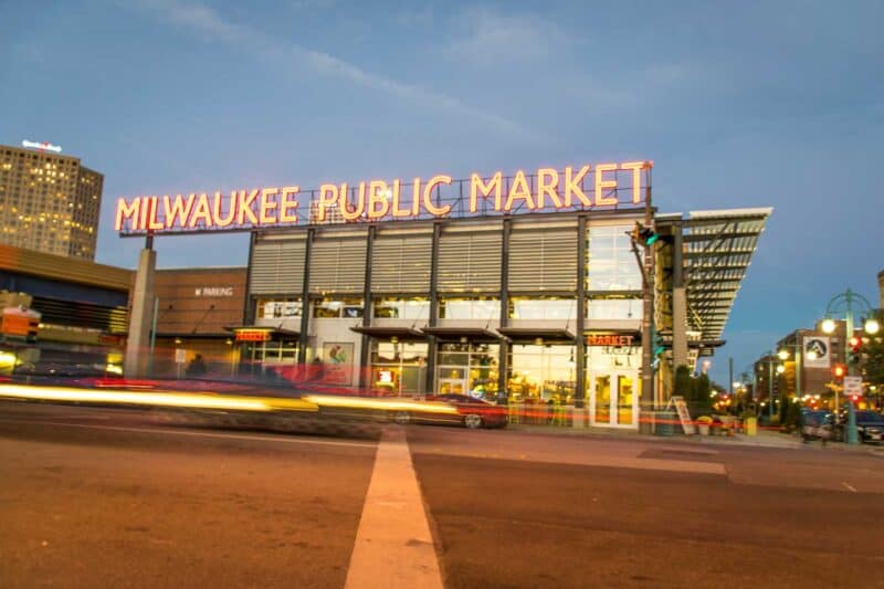 Milwaukee Public Market at night with traffic streaks