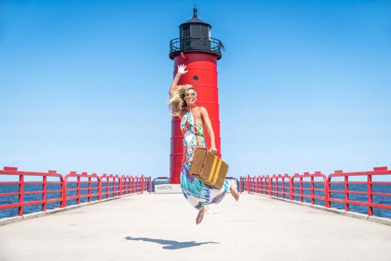 girl jumping at Northpoint lighthouse Milwaukee