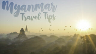 featured image with text Myanmar travel tips - Yellow and blue sunrise over bagan with starburst