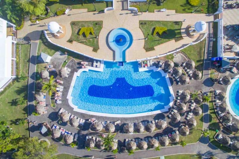 The main pool at the Riu Negril surrounded by huts 