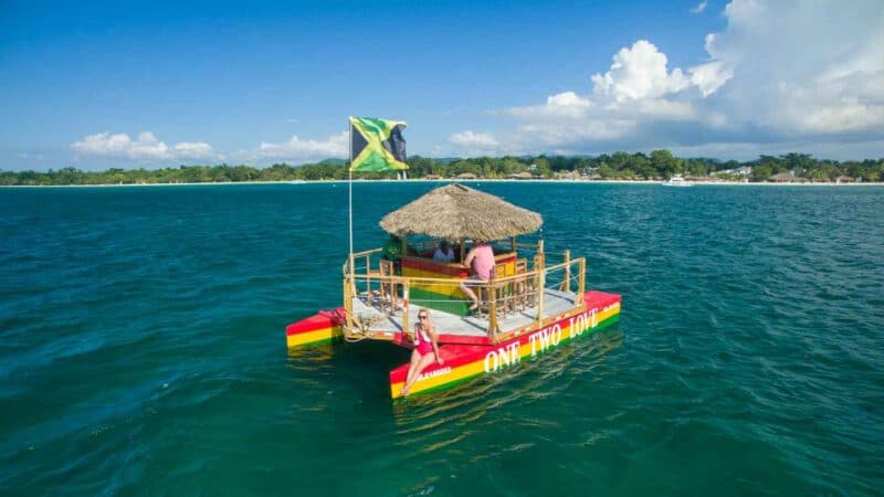 girl on floating Tiki Bar Negril Jamaica