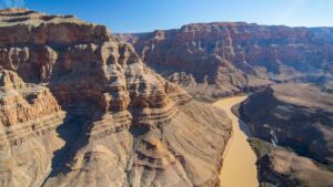 A view of the grand canyon and the colorado river from the window of the Cheapest Grand Canyon Helicopter Tour