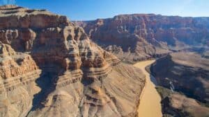 A view of the grand canyon and the colorado river from the window of the Cheapest Grand Canyon Helicopter Tour