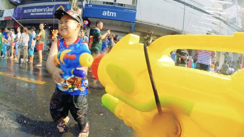 Boy with water gun at Songkran festival in Chiang Mai