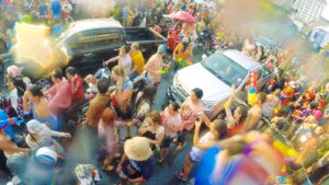 Large group of people playing at the Chiang Mai Tei Phe Gate during songkran in northern Thailand