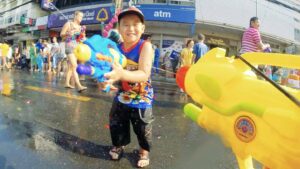 Young boy with squirt gun at Songkran festival in Chiang Mai