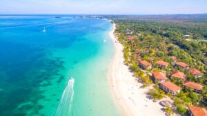 Ariel photo of 7 mile beach in Negril Jamaica with boat in front of the beach