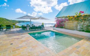 The large outdoor space and pool at CeBlue Villas in Anguilla