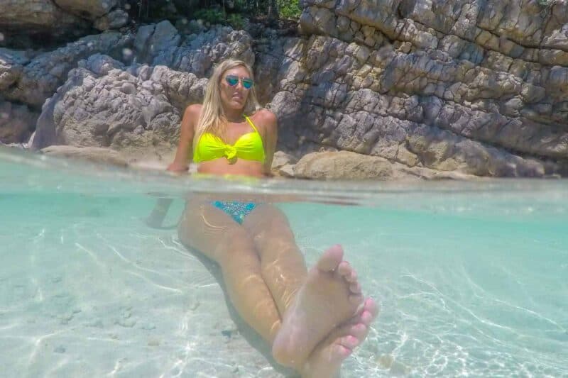 Woman in crystal clear waters of Labadee Haiti