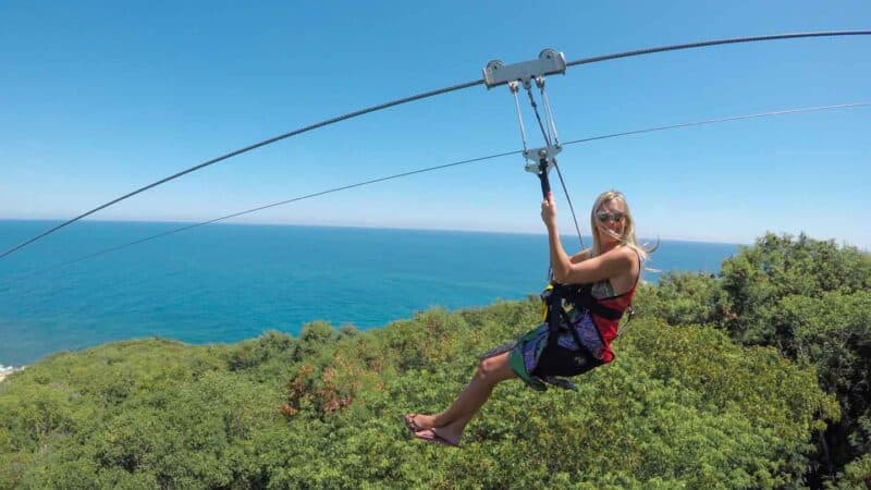 woman riding the dragon's breath flight line in Labadee Haiti